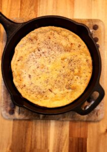 cast iron skillet with a pancake