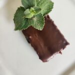 Brownie with a mint leave garnish