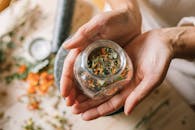 A Person Holding a Glass Jar